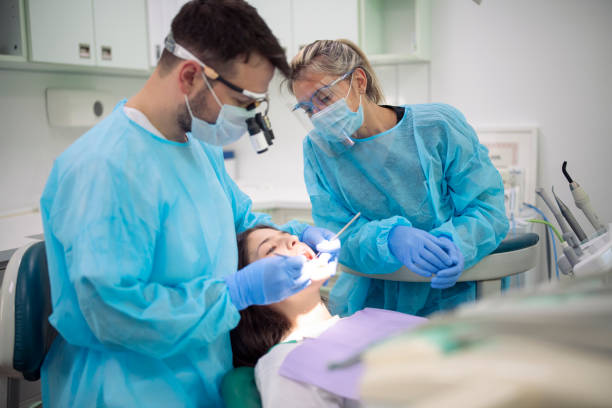 dental professionals working on a dental patient