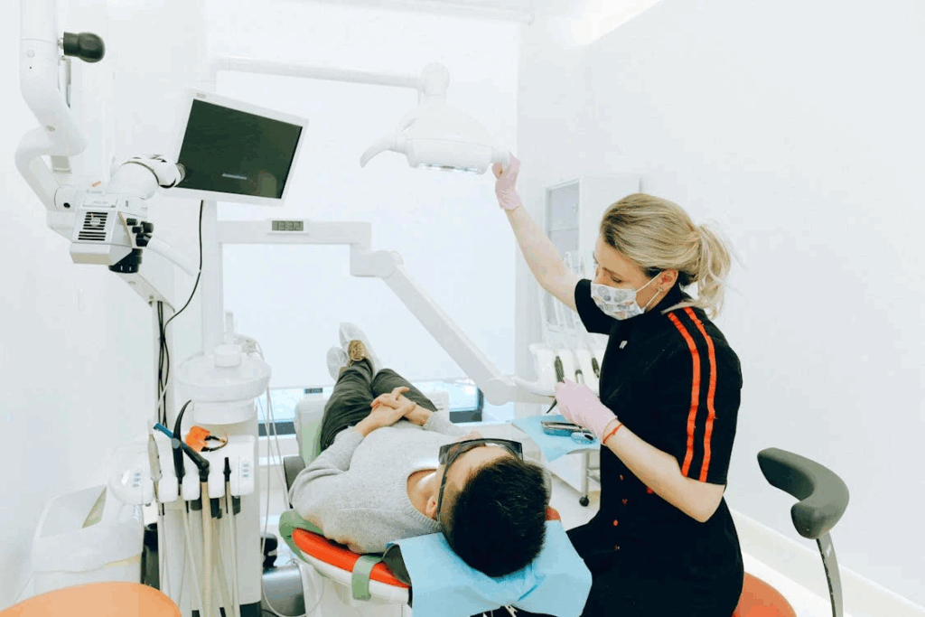a dental professional getting the dental device ready