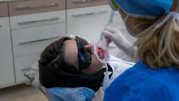 a photo showing a patient during a dental treatment